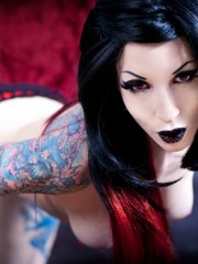Hot tattooed goth chicks exposing their lusciously formed body.