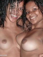 Two chocolate exotic gals with big tits having much fun taking part in amateur photo session