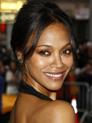 Zoe saldana wows the crowd as she walks the red carpet with her with her backless gown with long silver and black skirt.