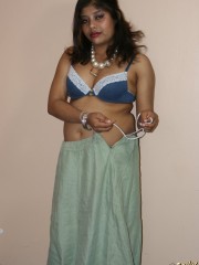 Cool pics with a real indian girl in a blue sari undresses to expose her chubby delights on cam